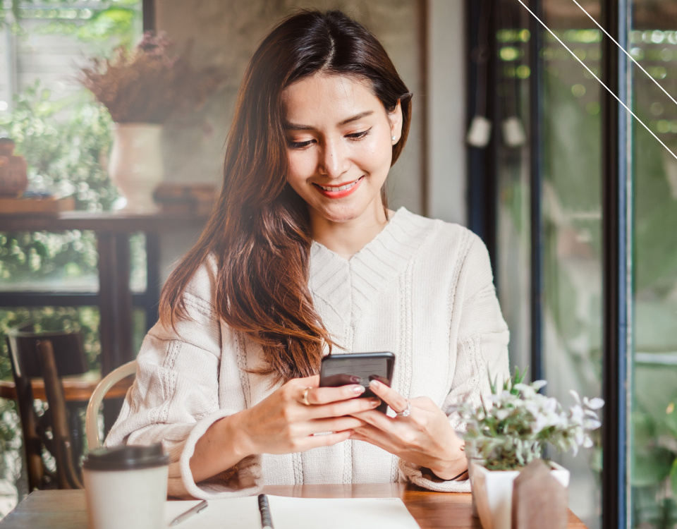 young-happy-woman-looking-at-mobile-phone-v2-1 young-happy-woman-looking-at-mobile-phone-v2-1